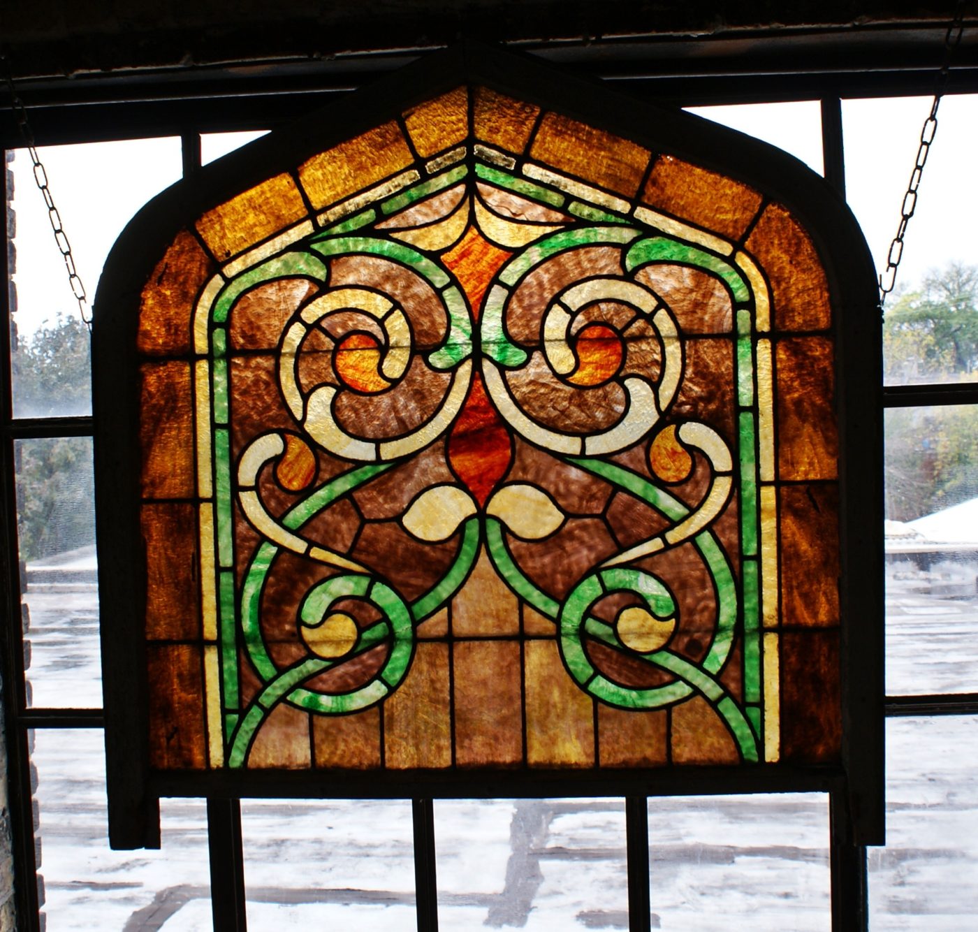 Brown Border Gothic Arch Stained Glass w Swirls in Frame