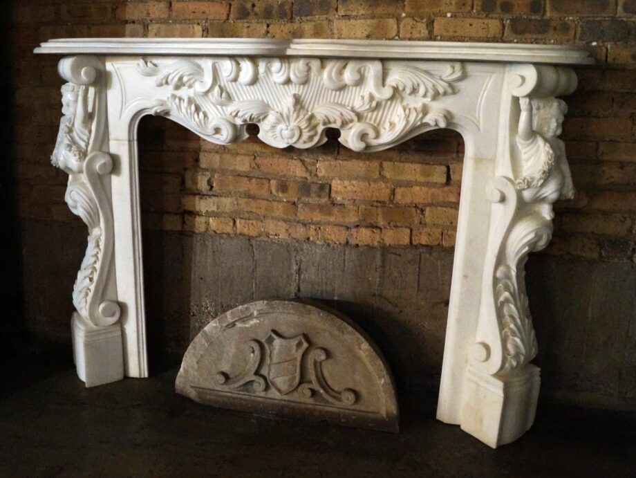 White Marble Mantel w Cherub Carvings