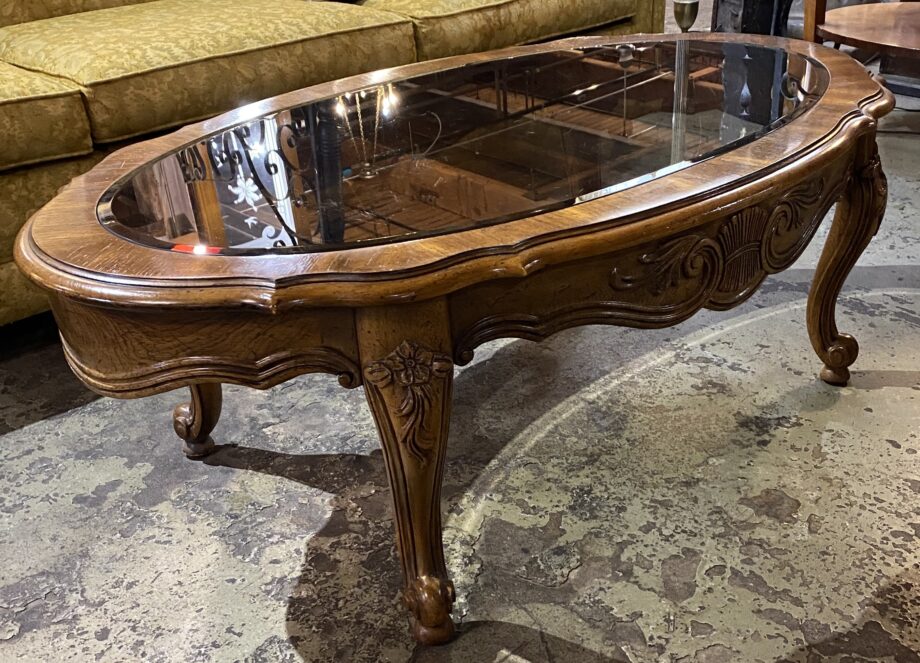 Burled Oval Coffee Table w Carvings and Smoke Glass