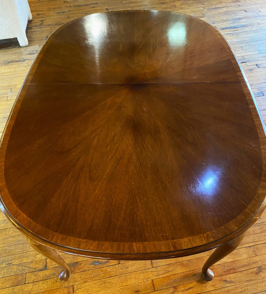 Dark Wood Oval Dining Table w Light Trim and 2 Leaves