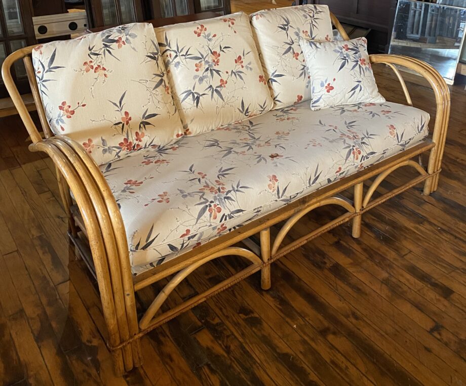 Rattan Couch w Ivory Floral Cushions