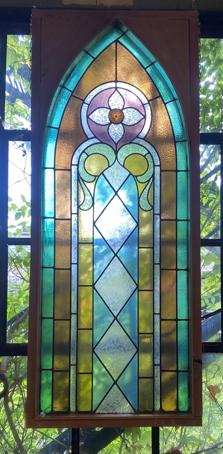 Tall Arched Multicolored Framed Stained Glass